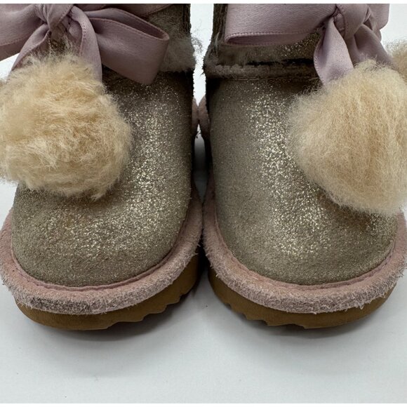 UGG Infant Girls Metallic Gold Sheepskin Bow Booties With Pom-Poms - Picture 6 of 11